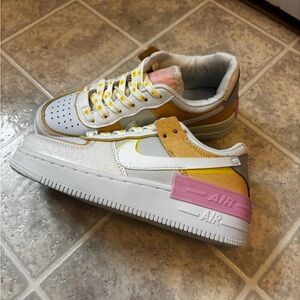 Nike Women's Sneakers with Yellow and Pink Accents